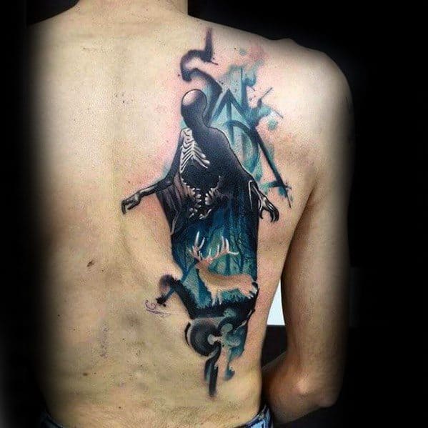 Large back tattoo of a Dementor with skeletal chest, glowing blue highlights, a stag Patronus, and the Deathly Hallows symbol.