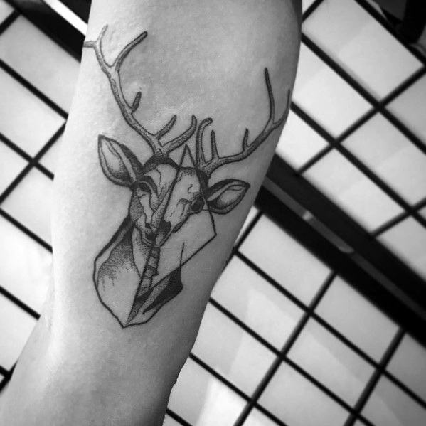 Minimalist black and grey elk tattoo on the forearm, featuring fine linework, geometric elements, and subtle shading for a modern and artistic design.