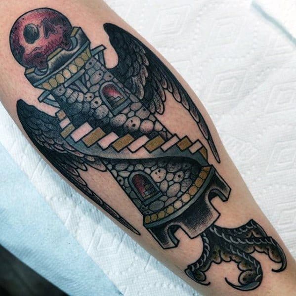Tattoo of a winged stone tower with staircases, a red skull atop, and clawed base, blending medieval and fantasy elements in bold colors.