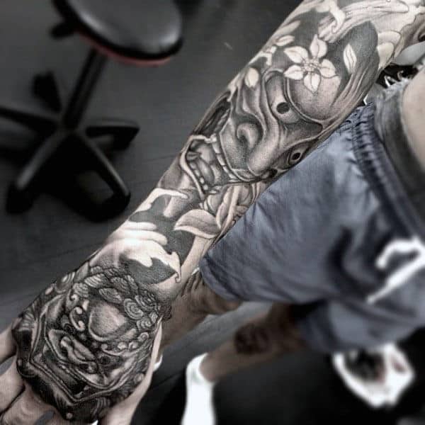 Manly Foo Dog Hand Tattoo On Man