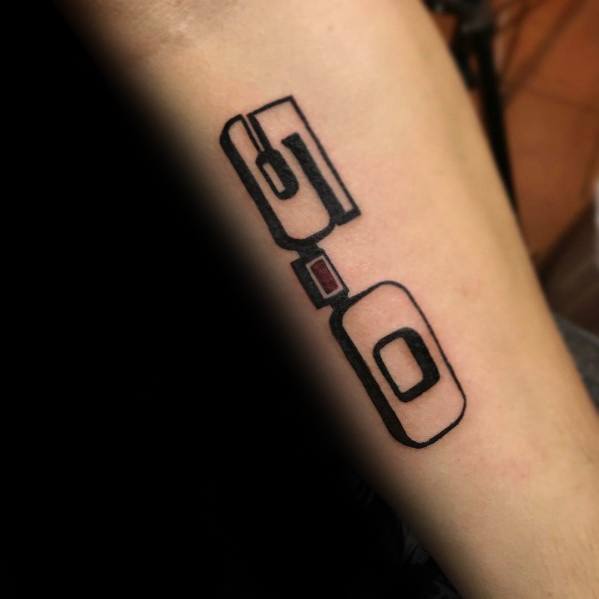 Minimalist Ford GT90 logo tattoo on forearm, featuring bold black outlines and subtle red detailing in a sleek and modern design.