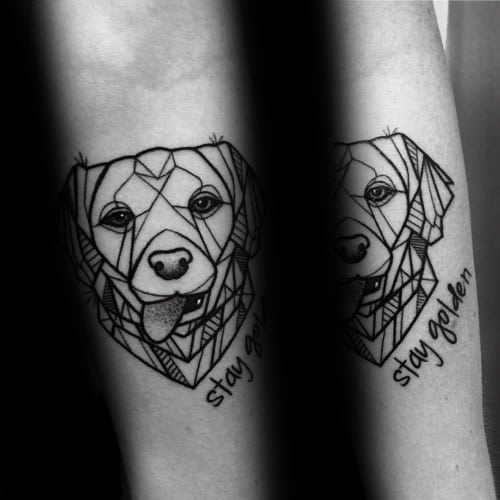 Geometric Golden Retriever tattoo on the forearm, featuring bold linework, intricate patterns, and the phrase "stay golden" for a unique touch.