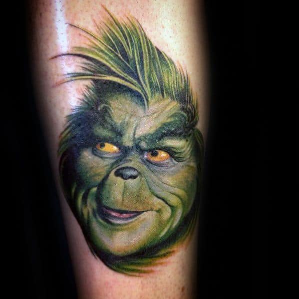 Vibrantly colored Grinch face with a mischievous expression and spiky hair, capturing his playful yet sly character in a dynamic tattoo design.