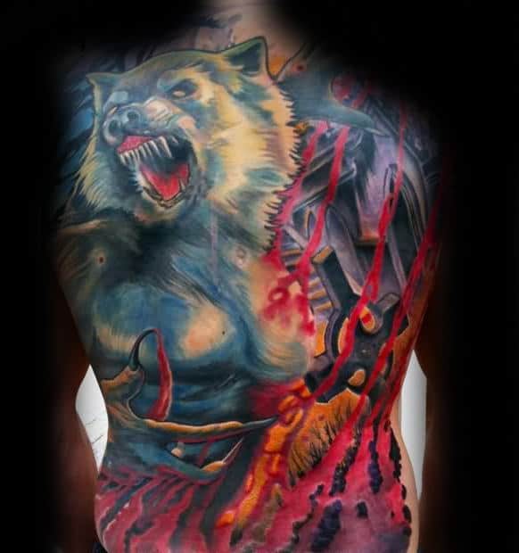 Detailed back tattoo featuring a snarling wolf and abstract design elements in vivid colors