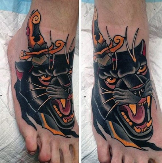 Detailed panther head tattoo with a dagger inked on feet
