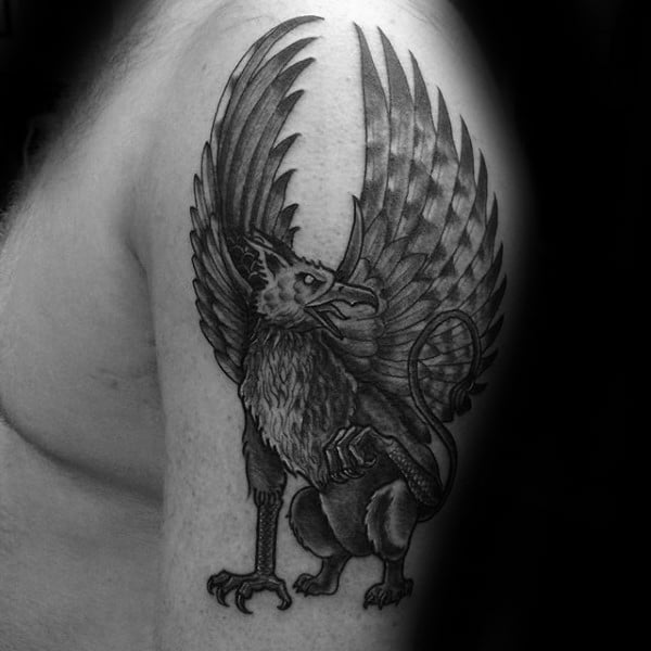 Manly Guys Upper Arm Tattoo Of Griffin Design