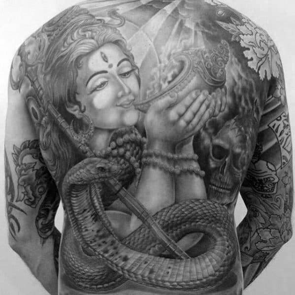 Intricate black and grey full-back tattoo showing a serene divine figure holding a conch shell, with a large coiled serpent and symbolic elements like a skull and trident.