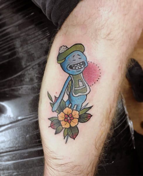 Tattoo of Mr. Meeseeks from Rick and Morty wearing a winter hat and scarf, standing on a flower with a red dotted background.