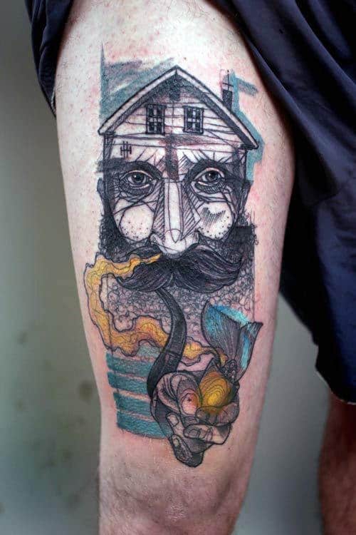 Tattoo of a house with a face and a hand holding a glowing item on a person's thigh