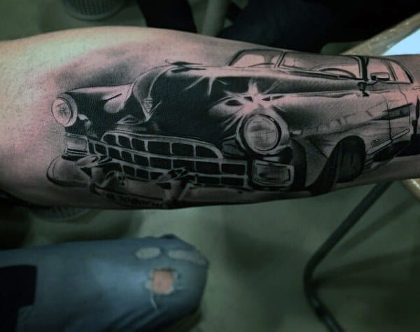 Tattoo of a vintage car on the bicep