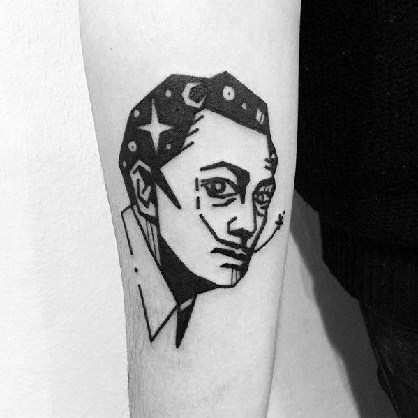 Bold blackwork tattoo of Salvador Dali with a geometric, abstract style featuring stars, crescent moon, and surreal minimalist detailing.