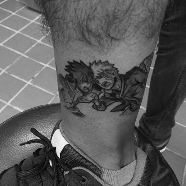 Black and white tattoo of Naruto and another anime character on a person's leg