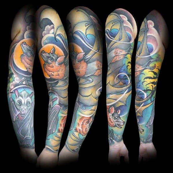 Full sleeve tattoo with vibrant neo-traditional bats in flight, set against a swirling sky, moon, and clouds in rich, bold colors.
