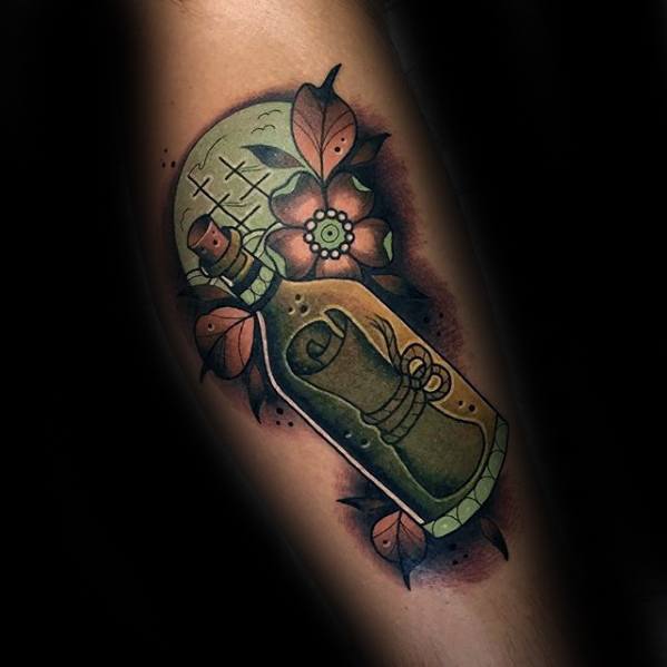 Traditional-style tattoo of a message in a bottle with flowers and vibrant shading details