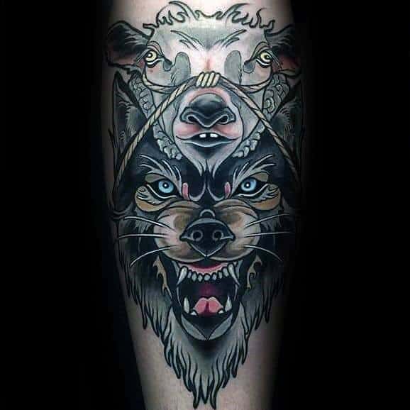 Neo-traditional tattoo of a snarling wolf with piercing blue eyes, a sheep mask tied above, symbolizing deception, with bold shading and fine details.