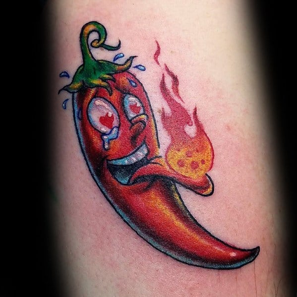 Cartoon-style chili pepper tattoo with a playful expression, heart-shaped eyes, and a flaming tongue, creating a fun and fiery design.