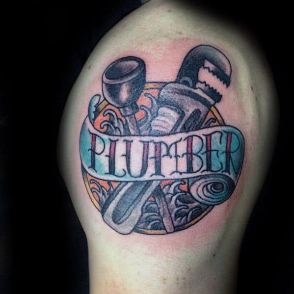 Tattoo of a plunger, wrench, and pipe with a swirling water background and a banner across reading PLUMBER in bold letters.
