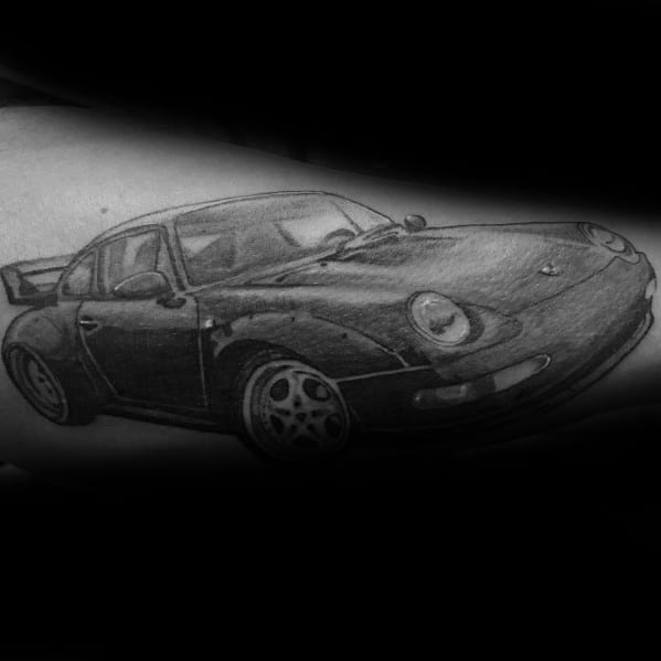 Realistic shaded Porsche tattoo emphasizing sleek lines and detailed wheel design.