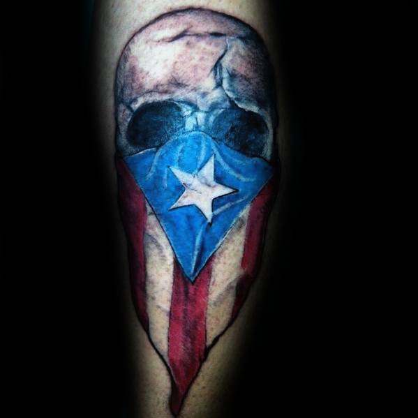 Skull tattoo with a Puerto Rican flag bandana, featuring bold red, white, and blue colors with a striking star design.