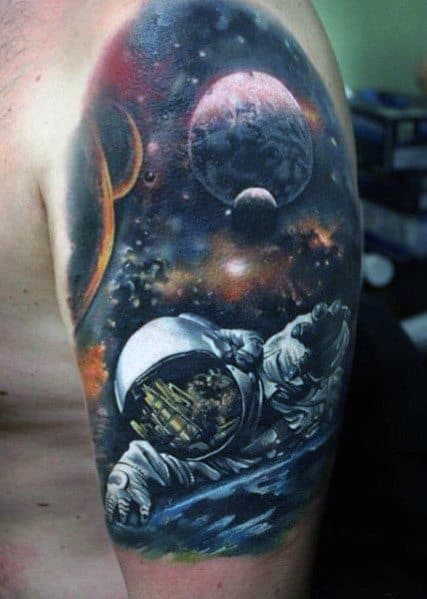 Tattoo of an astronaut floating in space with a cityscape reflection in the helmet, blending realism and cosmic elements for a stunning design.