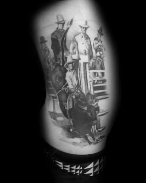Realistic black and grey tattoo of a rodeo scene, featuring a cowboy riding a bull with spectators and judges in the background, capturing Western culture.