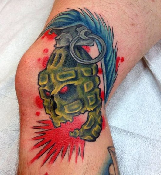 Manly Skull Grenade Tattoo On Knee With Exploding Red Ink
