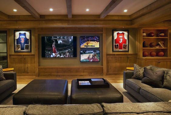 sports themed bar gray sofa large screen tv framed jersey