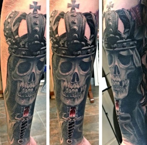 Manly Tattoo Of Crowned Skull And Knife Tattoo On Forearms