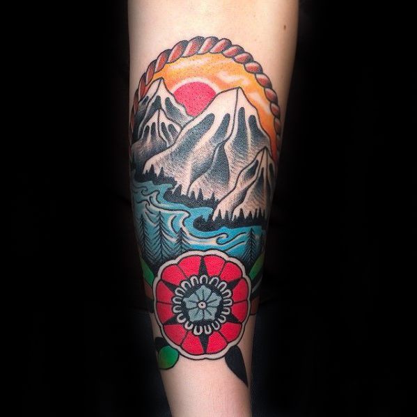 Traditional mountain tattoo with snowy peaks, flowing river, sunset sky, and a bold red flower at the bottom framed in rope.