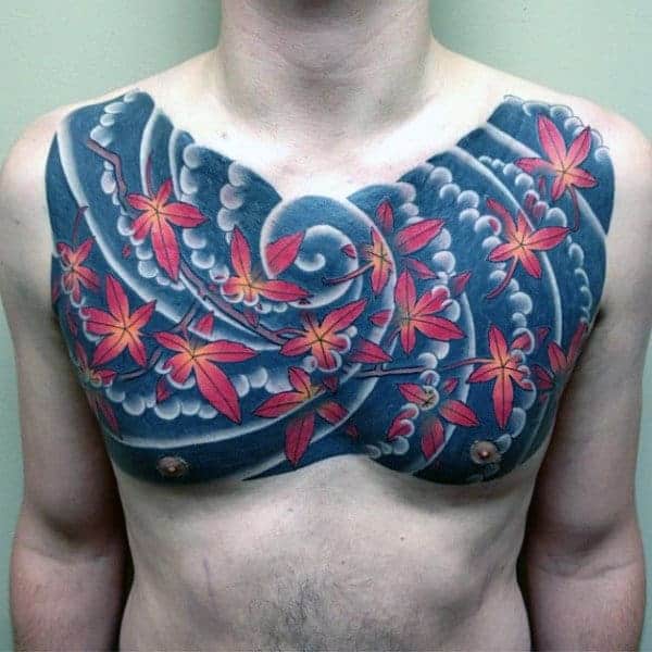 maple-leaves-blowing-in-the-wind-japanese-mens-upper-chest-tattoo