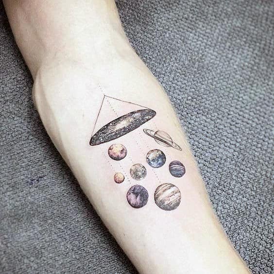 Minimalist tattoo of a UFO beaming up planets, blending space and surrealism with fine linework and soft shading for a cosmic aesthetic.