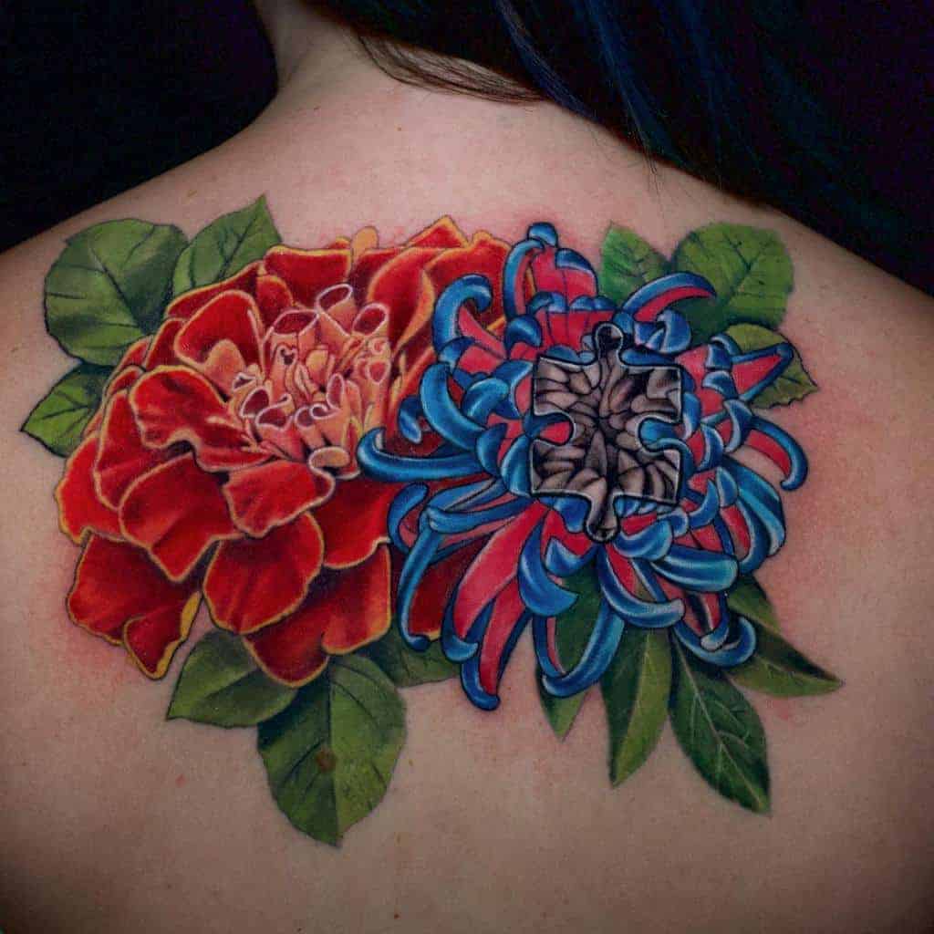 Vibrant marigold and chrysanthemum tattoo with rich colors and realistic shading, symbolizing beauty and resilience