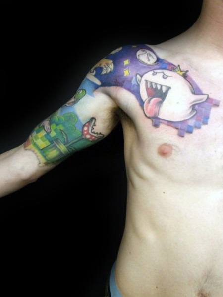 Mario-themed tattoo sleeve featuring King Boo with a crown, pixelated background, and classic elements like Piranha Plant and blocks, inked in bold colors.