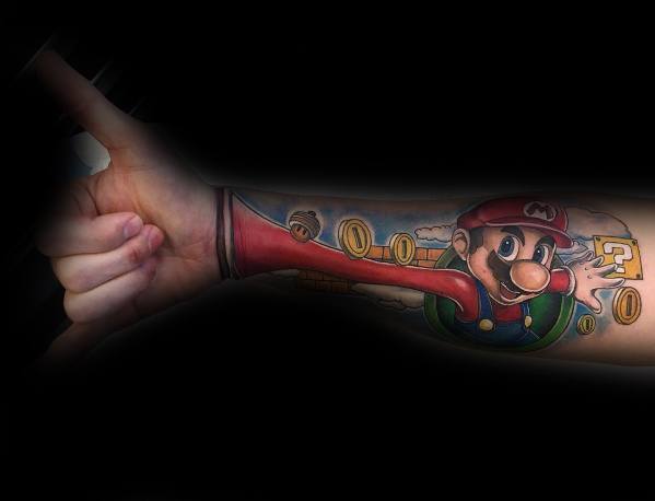 Creative *Super Mario* tattoo with a 3D effect, showing Mario reaching out from a warp pipe with coins and a question block, blending art with realism.