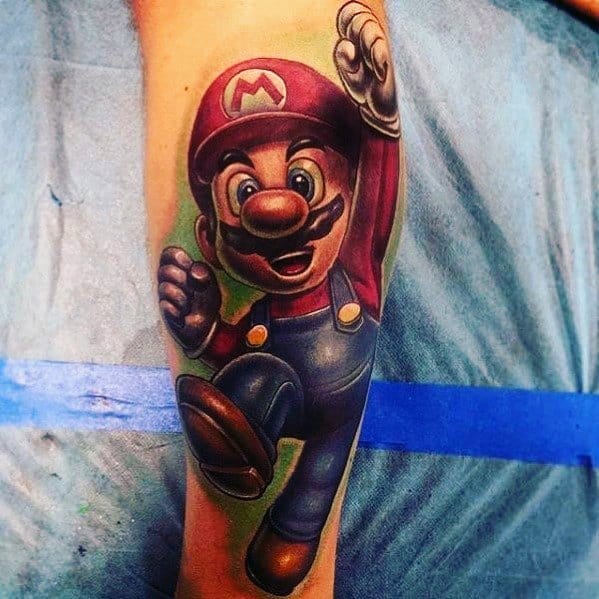 Realistic *Super Mario* tattoo with bold shading and vibrant colors, capturing Mario mid-jump in an action-packed, dynamic pose.