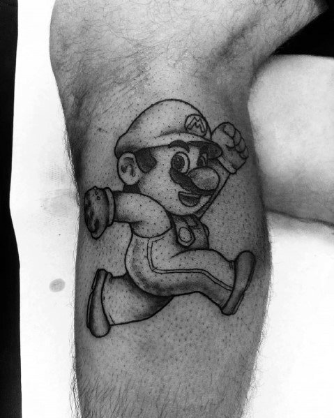 Black and gray *Super Mario* tattoo with dotwork shading, featuring Mario in a classic running pose for a nostalgic and minimalist gaming design.