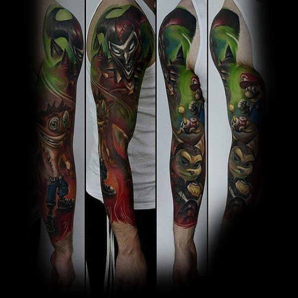 Epic full-sleeve gaming tattoo featuring *Super Mario*, *Crash Bandicoot*, *Ratchet & Clank*, and *Joker*, blending bold colors with dynamic shading.
