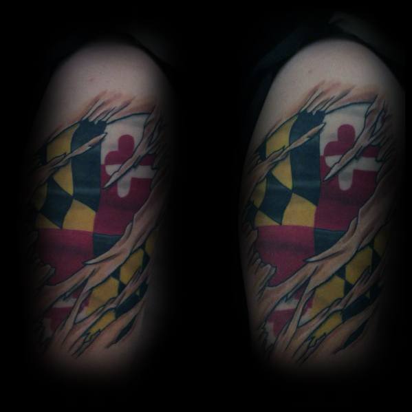 Maryland flag tattoo with a torn skin effect on the upper arm, creating a bold 3D illusion of the flag beneath the surface.