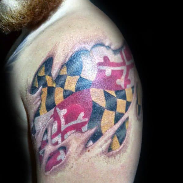 Maryland flag tattoo on the shoulder with a torn skin effect, creating a bold 3D illusion of the flag beneath the surface.