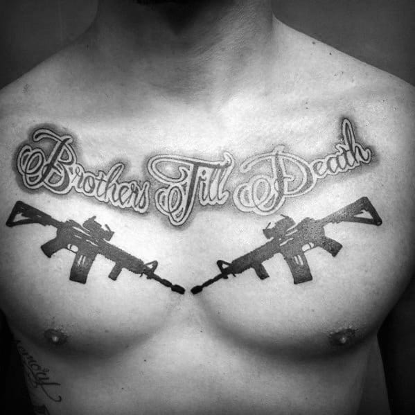 Black and grey chest tattoo featuring two AR-15 rifles crossed under the phrase "Brothers Till Death," symbolizing loyalty, brotherhood, and strength.
