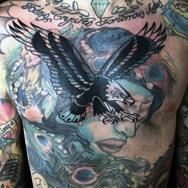 Blast over eagle tattoo on colorful chest design with script above