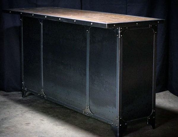 A sleek, industrial-style black metal bar with rivet detailing and a wooden top