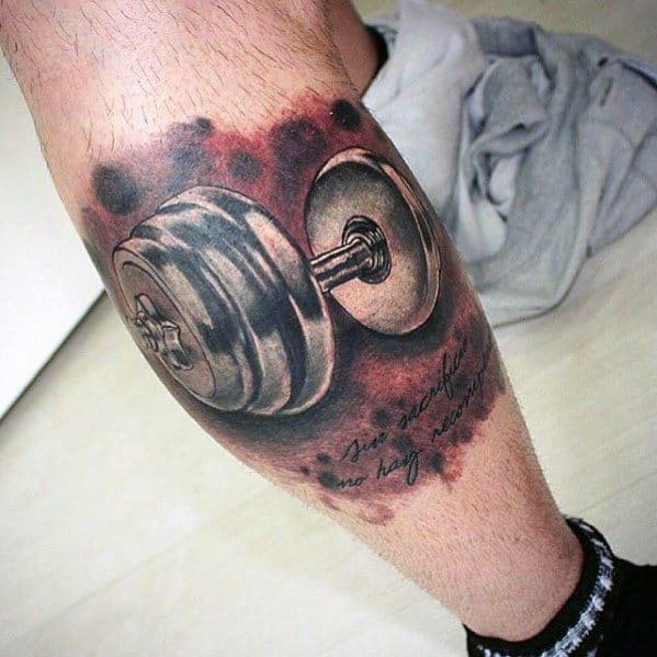 Realistic dumbbell tattoo with red and black ink shading and cursive quote, symbolizing inner strength, resilience, and personal motivation.