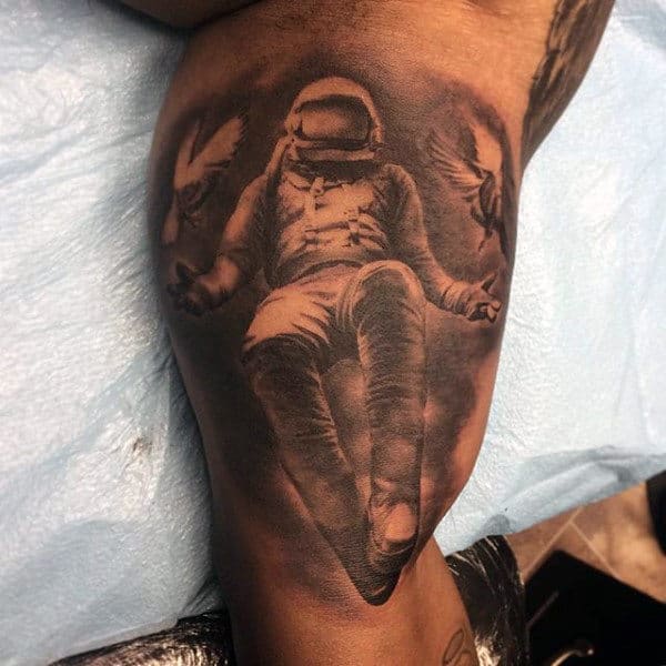 Masculine Bicep Astronaut And Doves Shaded Tattoos On Man
