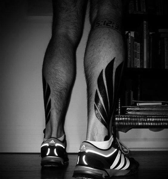 Masculine Bold Black Ink Hermes Wing Leg Tattoo Ideas