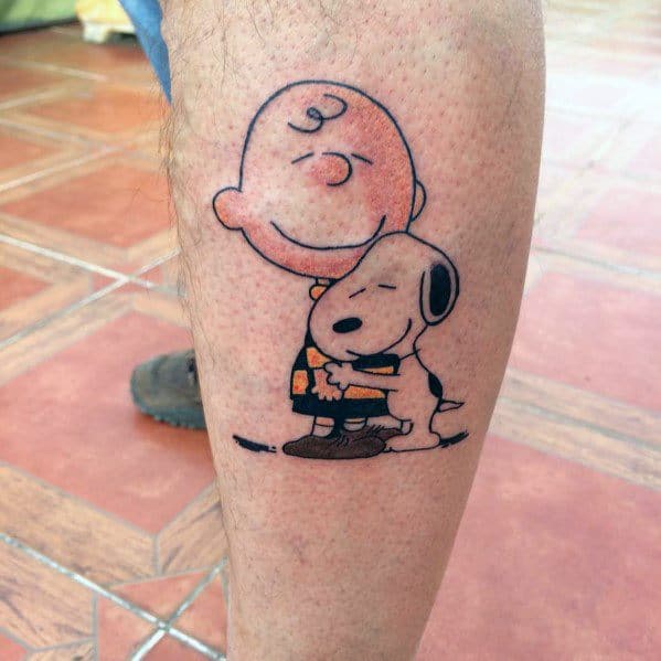 Heartwarming Charlie Brown and Snoopy tattoo featuring a tight hug, symbolizing love, friendship, and the timeless bond of Peanuts.