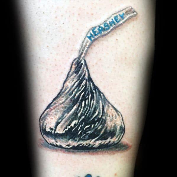 This realistic tattoo of a **Hershey's Kiss** captures the metallic wrapper's shine and the signature paper plume, making it instantly recognizable!