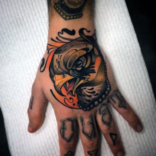 Masculine Falcon Hand Tattoo For Men With Neo Traditional Design