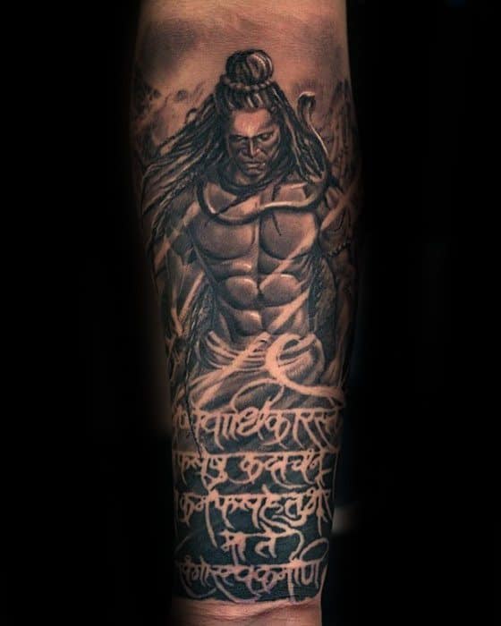 Forearm tattoo of a powerful Lord Shiva with flowing hair and intense gaze, featuring Sanskrit shloka text wrapping around the lower arm.