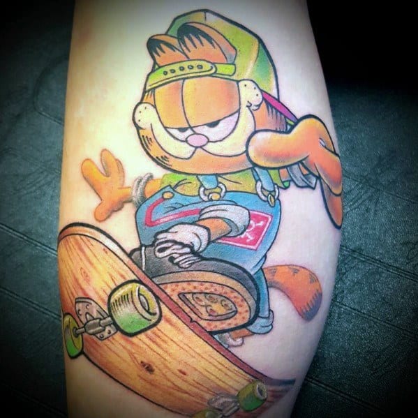 Garfield tattoo rocking a skateboard, cap, and streetwear—bold and colorful design capturing a cool, urban vibe.